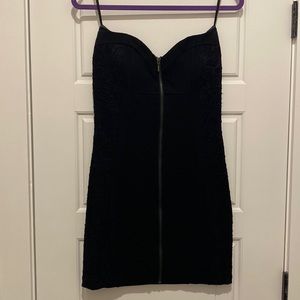 Black strapless mini dress with lace accenting sides of dress